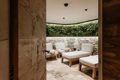 a group of white chairs sitting in a room at Fox on the Rocks Chalet in Bohinj