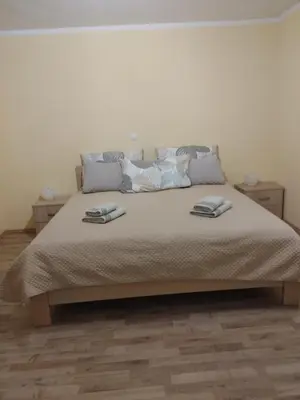 a bedroom with a bed with two towels on it at Apartma svizec in Bled