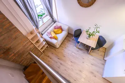 an overhead view of a living room with a couch and a table at The Modern Loft in Ljubljana