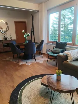 a living room with a couch and chairs and a table at Luxury Wide View Apartment Pohorje Bellevue in Pohorje
