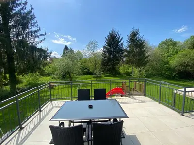 a patio with a table and chairs on a balcony at VILA ADA - 4 Cosy Apartments in Ljubljana