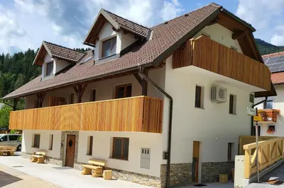 a house with wooden balconies on top of it at New Apartments Teravila in Rateče