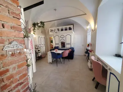 a kitchen and dining room with a table and chairs at Vintage Apartment In The City Centre Old Town in Ljubljana