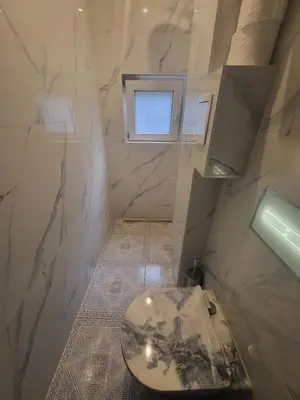 a bathroom with a toilet and a window at Vintage Apartment In The City Centre Old Town in Ljubljana