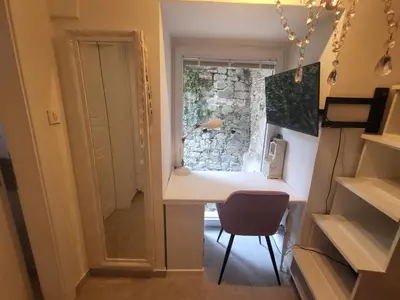 a small room with a desk and a chair at Vintage Apartment In The City Centre Old Town in Ljubljana