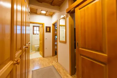 a hallway with a door and a bathroom at Bolfenk Snowflake app in Pohorje