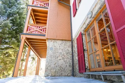 an exterior view of a building with large windows at Bolfenk Snowflake app in Pohorje