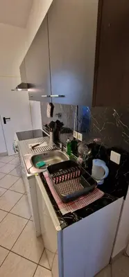 a kitchen with a sink and a counter top at Apartman MURKO P-1 in Brest