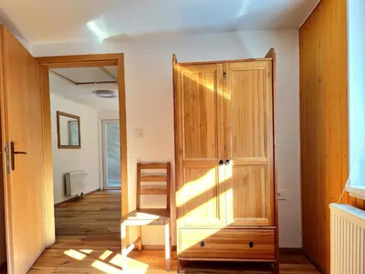 a room with a wooden door and a stair case at Bella Bela Apartments 23 in Bled