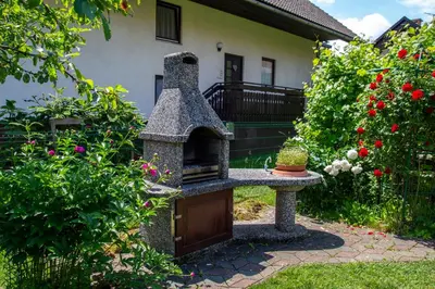 a stone oven in the yard of a house at La casa verde in Bled-Rečica