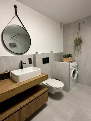 a bathroom with a sink and a toilet and a mirror at La casa verde in Bled-Rečica