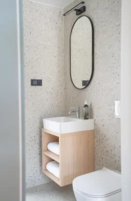 a bathroom with a sink and a toilet and a mirror at Cabino - Fresh Air Resort in Bovec