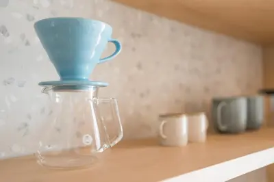 a glass jar with a blue top sitting on a counter at Cabino - Fresh Air Resort in Bovec