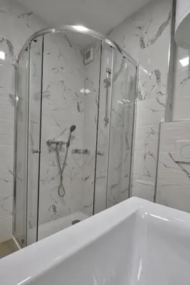a bathroom with a shower and a bath tub at Studio Pika in Kranjska Gora