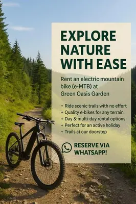 a bike parked on a dirt road with a sign at Green Oasis Garden in Šenčur