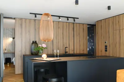 a kitchen with a island in the middle of a room at Studio Vilawin Kranjska Gora in Kranjska Gora
