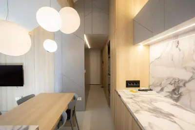 a room with a marble counter and some lights at Studio Vilawin Kranjska Gora in Kranjska Gora