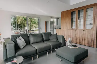 a living room with a couch and a table at Janina's Dragonfly house in Nova Vas