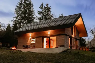 a small house with a solar roof on top of it at Janina's Dragonfly house in Nova Vas