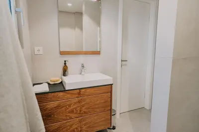 a bathroom with a sink and a mirror at Janina's Dragonfly house in Nova Vas