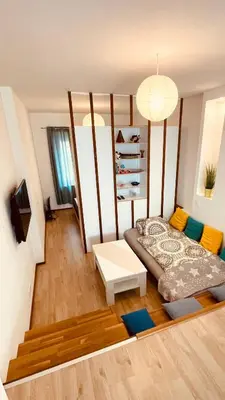a small room with a bed and a table at Blue Sun in Ljubljana