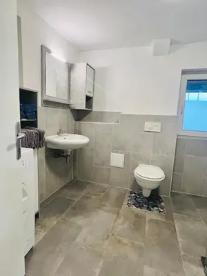 a bathroom with a toilet and a sink at Blue Sun in Ljubljana