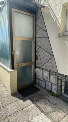 a door on the side of a building at Blue Sun in Ljubljana