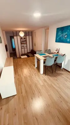 a dining room with a table and chairs at Blue Sun in Ljubljana