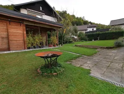a small table in the yard of a house at House Stepic in Sava