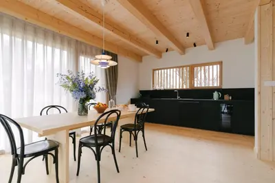 a dining room with a wooden table and chairs at PIRA HOTEL in Postojna