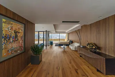 a living room with a large painting on the wall at Chalet Sofija in Gozd Martuljek