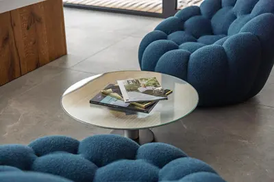 a table with a book on it next to blue chairs at Chalet Sofija in Gozd Martuljek
