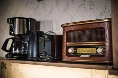 a microwave sitting on a shelf with a coffee maker at Holiday home in Srednje Grcevje - Kranjska Krain 26095 in Srednje Grčevje