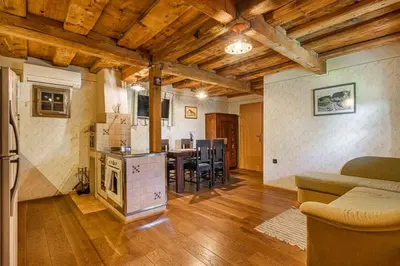 a living room with a kitchen and a dining room at Holiday home in Srednje Grcevje - Kranjska Krain 26095 in Srednje Grčevje