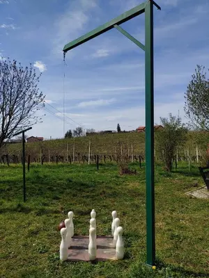a group of white sculptures sitting on a board in a field at POČITNIŠKA HIŠA PRLEČKA in Miklavž pri Ormožu
