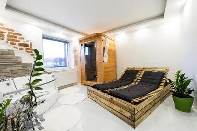 a room with a bed in the middle of it at Luxe Apartments in Ljutomer