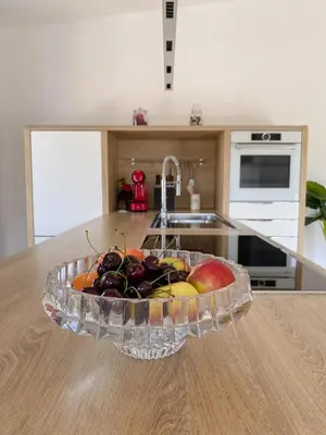 a bowl of fruit on a counter in a kitchen at Vila Maister in Celje