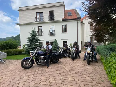 a group of motorcycles parked in front of a house at Vila Maister in Celje