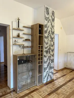 a room with a sink and a wall with shelves at Apartments & wellness Kal Koritnica in Bovec