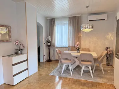 a dining room with a table and chairs at Apartments & wellness Kal Koritnica in Bovec