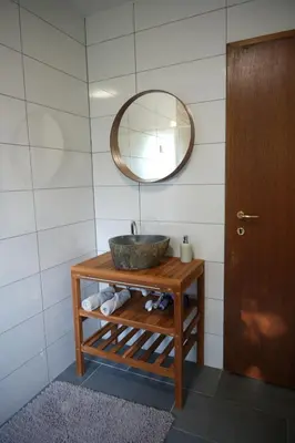 a bathroom with a sink and a mirror at Rooms and apartments Biš in Trnovska Vas