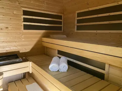 two rolls of towels sitting in a sauna at Spacious apartment in nature with sauna! in Postojna
