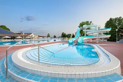 a large swimming pool with a water slide at Terme Banovci - Hotelsko naselje Zeleni gaj in Banovci