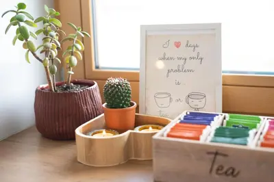 a table with a plant and two trays with plants at Home Away From Home in Radovljica