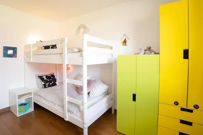 a bunk bed room with a white bunk bed at Home Away From Home in Radovljica
