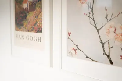 two framed paintings of flowers on a wall at Home Away From Home in Radovljica