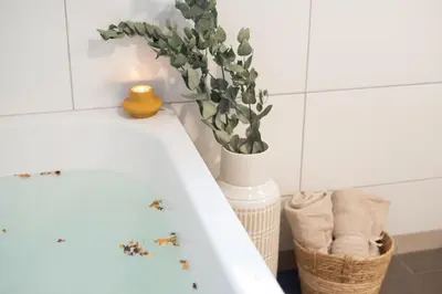 a bathroom with a white sink with ants on the counter at Home Away From Home in Radovljica