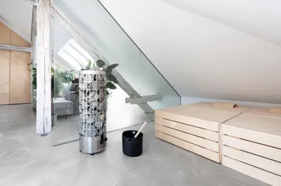 a living room with a staircase and a table at Sheila's Loft in Ljubljana