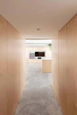 a room with a hallway with a television at Sheila's Loft in Ljubljana