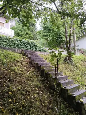 a set of stone steps in a park at Nice Apartment near by Capital of Slovenia in Ljubljana